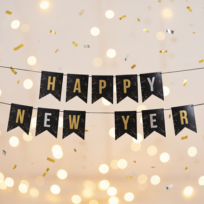 Close up detail of Happy New Year black bunting banner with gold letter tiles