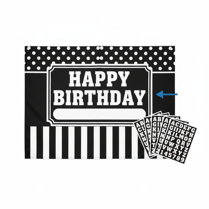 Black and white customizable door decoration kit flat lay showing large banner with polka dots stripes and alphabet letter stickers