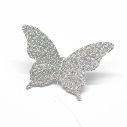 Glitter silver butterfly string decoration close up detail