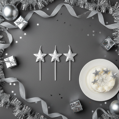 Silver star stick candles flat lay with silver ribbons gift boxes and party decor