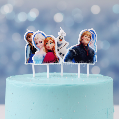 Close up detail of Disney Frozen character birthday candles showing Elsa Anna Olaf Kristoff design